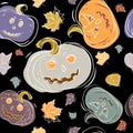 Halloween seamless pattern with pumpkins lanterns and autumn leaves of different colors on a black background. Vector Royalty Free Stock Photo