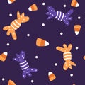 Cute halloween seamless vector pattern background illustration with candy corn, candies and white dots Royalty Free Stock Photo