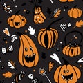 Halloween seamless vector pattern with different orange pumpkins on dark background