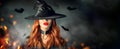 Halloween. witch portrait. Beautiful woman in witches hat with long curly red hair Royalty Free Stock Photo