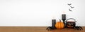 Halloween shelf display with candles and decor against a white wall banner Royalty Free Stock Photo