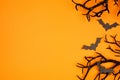Halloween side border of spooky bats and black branches over an orange background Royalty Free Stock Photo