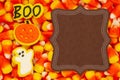 Halloween sign with candy corn, ghost, pumpkin, and boo