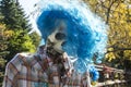 Halloween skeleton with a blue wig and shirt