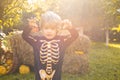 Halloween skeleton child. Halloween Kids Costume Party. Happy laughing child in costume to halloween. Funny kid in