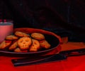 Halloween skill cookies with milk and butcher knife Royalty Free Stock Photo