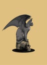 Halloween sphinx cat named Tokyo turned into a flying vampire gargoyle and sat down to rest on a skull Royalty Free Stock Photo