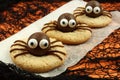 Halloween spider cookies with orange and black background