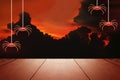 Halloween stage presentation with red sky, black clouds and creepy spiders. Royalty Free Stock Photo