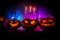 Halloween still-life background with different elements on dark toned foggy background. Selective focus Royalty Free Stock Photo