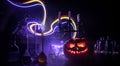 Halloween still-life background with different elements on dark toned foggy background. Selective focus Royalty Free Stock Photo