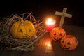 Halloween still life with pumpkins and candle on wooden floor Royalty Free Stock Photo