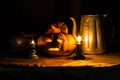 Halloween still life with pumpkins, candles and classic kettle Royalty Free Stock Photo