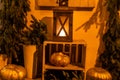 Halloween street decor. Stylish candle lantern and pumpkins on stairs, modern festive decoration of european city street