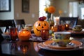 Halloween table setting with pumpkins and skulls