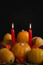 Halloween thanksgiving autumn composition pumpkins apples burning candles Royalty Free Stock Photo