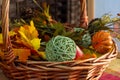 Halloween and Thanksgiving decorations in a home with fall colors, pumpkin, vegetables and a basket of decorations with a thankful