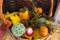 Halloween and Thanksgiving decorations in a home with fall colors, pumpkin, vegetables and a basket of decorations with a thankful