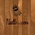 Halloween theme, dark wooden background with ghost.