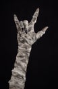 Halloween theme: terrible old mummy hands on a black background