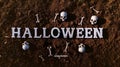 Halloween Themed Background with Skulls and Bones on Earth Royalty Free Stock Photo