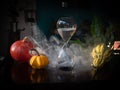 Halloween time countdown modern hourglass against a blurry background from the window - sand seeping through the bubbles of the Royalty Free Stock Photo