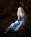 Halloween time, girl in white veil at forest Royalty Free Stock Photo