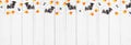 Halloween top border of candy corn and spooky chocolate ghosts and bats on a white wood banner background Royalty Free Stock Photo