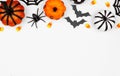 Halloween top border flat lay of pumpkins, candy and decor, over a white background Royalty Free Stock Photo