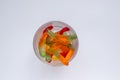 Halloween treats gummy worms in glass. Colorful jelly candies on white background. Top view Royalty Free Stock Photo