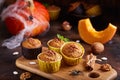 Halloween treats. Muffins with pumpkin, walnuts and cinnamon