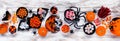 Halloween trick or treat candy table scene, above view on a white wood banner Royalty Free Stock Photo