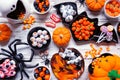 Halloween trick or treat candy table scene, above view on white wood Royalty Free Stock Photo