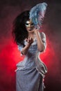 Halloween vampire woman with venetian mask