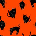 Halloween vector pattern with black cats on orange