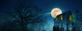 Halloween Wallpaper. Scary house near a cemetery with trees, full moon, bats, fog and pumpkins.  Spooky Halloween Picture Ideas Royalty Free Stock Photo