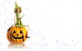 Halloween Witch and carved Pumpkin with magic lights. Copy space mock up Royalty Free Stock Photo