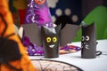 Halloween, witch hat, black paper bats on the table, paper crafts