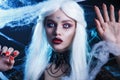 Halloween witch with long white hair wearing spider web Royalty Free Stock Photo