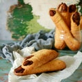 Halloween witch`s fingers cookies, funny recipe for Halloween party. Homemade cookies in form of terrible fingers.