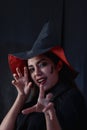 Halloween witch woman portrait, Fashion young woman going to party with spooky costume, makeup scary faces, having fun at