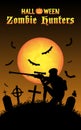 Halloween zombie hunter with sniper at graveyard