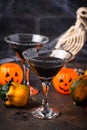 Halloweens spooky drink black martini cocktail Royalty Free Stock Photo
