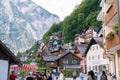 17.07.2020 Hallstatt. Austria. Colorful town with flowers and historical architecture in Austria Alps mountain. Tourists walk in Royalty Free Stock Photo