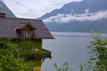 Extraordinary house on the lake, very original, against the backdrop of the mountains.