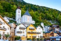 Hallstatt, Austria. Popular town with colorful historic houses and church in Austrian Alps mountains