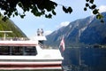 Hallstatt, Austria, September 2019. Famous mountain village in the Austrian Alps on a warm autumn day. Pleasure boat on the lake. Royalty Free Stock Photo