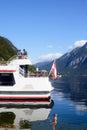 Hallstatt, Austria, September 2019. Famous mountain village in the Austrian Alps on a warm autumn day. Pleasure boat on the lake. Royalty Free Stock Photo