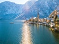 Hallstatt lakeside town in the Alps moutain ship on a beautiful cold sunny day with blue sky and c