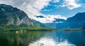 Hallstatt see lake near the Salzburg city. View of lake and big mountains in background. Cloudy weather, big clouds and mist over Royalty Free Stock Photo